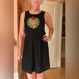 One-of-a-kind little black dress with bead and rhinestone heart detail. Size S/M
